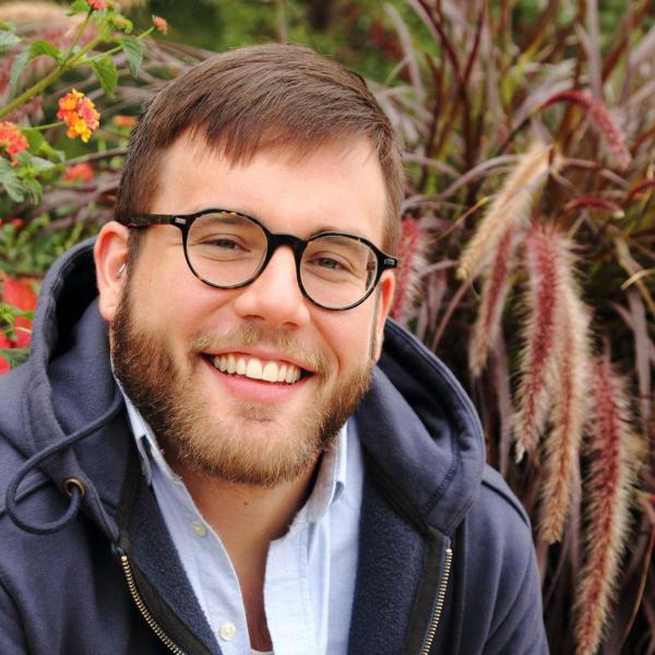 Jeremy Hoffman in front of plants