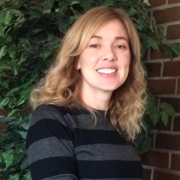 Kate Shay in front of a brick wall