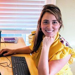 Kate Jager sitting at a desk