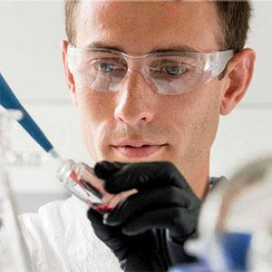 Adam Higgins working in a lab